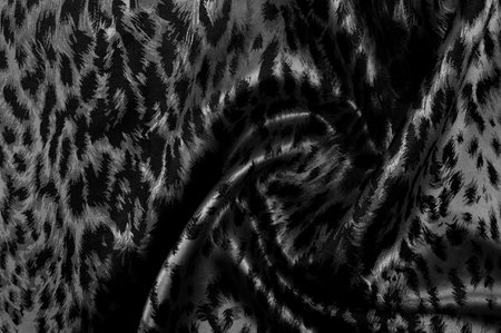 Seamless texture. black color. Made from high quality polyester and silk satin, this satin will embody your inner royal spirit. It is an elegant fabric with a more attractive appearance.の写真素材