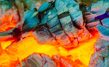 Create a warm and cozy atmosphere with a beautiful fire. Burning logs create natural warmth and atmosphere. Decorate your indoor or outdoor space with mesmerizing flickering flames.の写真素材