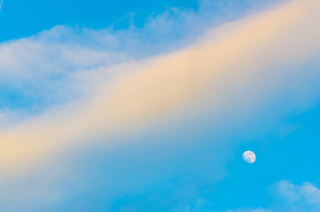 sky, Clouds float into my life, not to bring rain or cause a storm, but to add color to my sunset sky. The sun always shines above the cloudsの写真素材