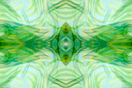 Seamless kaleidoscope. Fabric silk green-blue shades. Vibrant colors and scalloped shapes create a truly unique crepe de chine in yellow, blue and green geometric silk crepe de chine.の写真素材