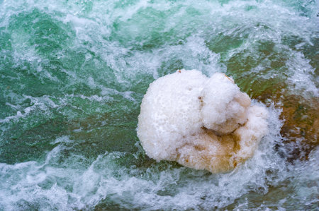 The river freezes in winter. My favorite winter river Silence in the forest was magical, broken only by the sound of the wind and the stream running, still alive, under the water. snow and iceの写真素材