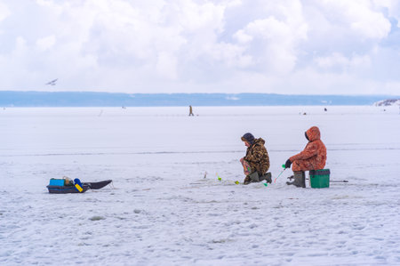 Winter ice fishing. Ice fishing is a great way to pass the time during the winter months and gives anglers the chance to catch some truly trophy fish.の写真素材