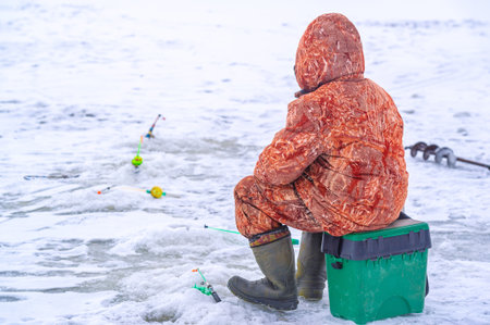 Winter ice fishing. Ice fishing is a great way to pass the time during the winter months and gives anglers the chance to catch some truly trophy fish.の写真素材