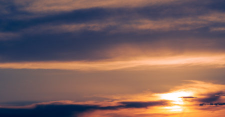 Clouds dawn sunset romance. Gentle romantic pink clouds at dawn. Gentle mood of sunrise, sunset, dusk, sky.の写真素材