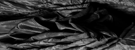 Premium black silk fabric is an exceptional fabric, beautiful on its own or as an accessory to highlight your perfect choice.の写真素材