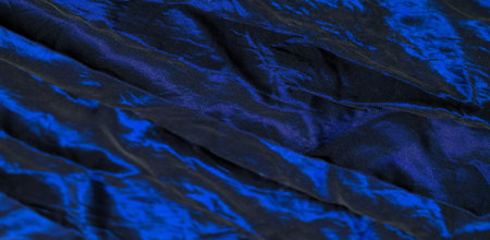 Blue fabric. Once you see this classic blue silk shantung, you'll want to get your hands on it. A luxurious and simple material with a variety of stripes, making it the perfect choice for your designの写真素材