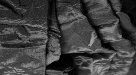 Premium black silk fabric is an exceptional fabric, beautiful on its own or as an accessory to highlight your perfect choice.の写真素材