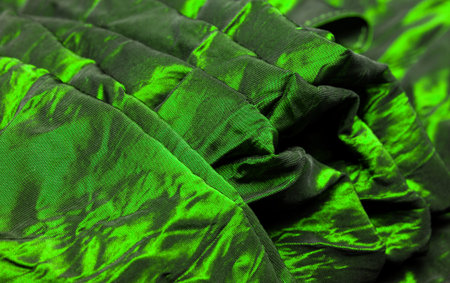 Green silk fabric. Take a look at this beautiful green silk fabric. Fluffy to look at, pleasant to the touch, and paired with your background, fabrics are perfect for all sorts of designs.の写真素材