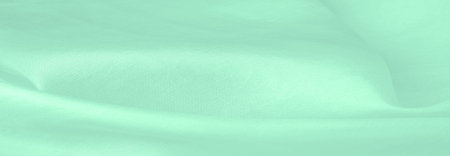 Blurred green silk fabric. Showcasing a warm green color with a silky soft texture, the satin weave...