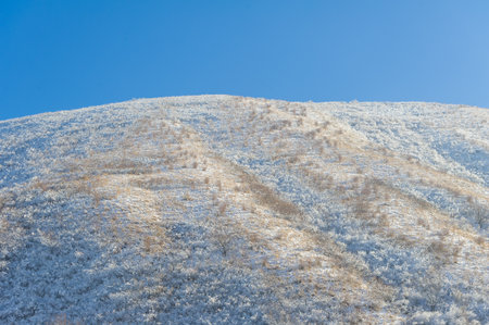 The mountains. Winter. Get to know the beautiful scenery on winter hikes. From streams covered with sparkling ice to snow-capped mountains and convenient paths.の写真素材