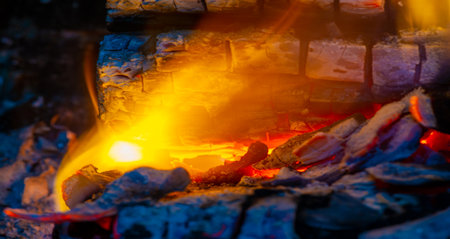 Experience the warmth and comfort of burning wood Create an energetic and lively atmosphere with a bright flame Treat yourself to a soothing atmosphere created by a flickering fireの写真素材