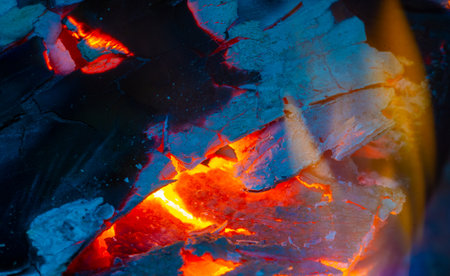The flame creates a warm and cozy atmosphere Burning wood is energetic and bright Create a cozy atmosphere with a bright flame of burning woodの写真素材