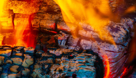 Bright wood fire. Cozy and warm atmosphere Ideal for gathering and roasting marshmallows Aesthetically pleasing and adds a natural element to any spaceの写真素材