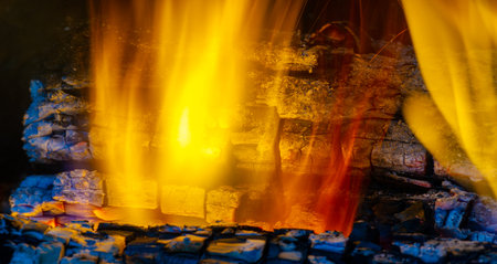 Bright wood fire. Cozy and warm atmosphere Ideal for gathering and roasting marshmallows Aesthetically pleasing and adds a natural element to any spaceの写真素材