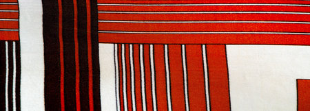 silk fabric with a red-brown pattern with white stripes. Poncho with Mexican motives. texture, backgroundの写真素材