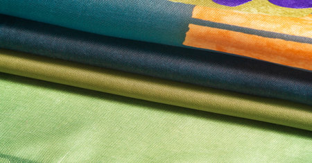 Background texture, silk fabric, shiny green light green color, with a small abstract print of rock...