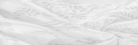 Silk fabric, snow-white fabric. Shades of delicate exquisite flowers on a white background, photo of Paisley print. Texture, pattern, collectionの写真素材
