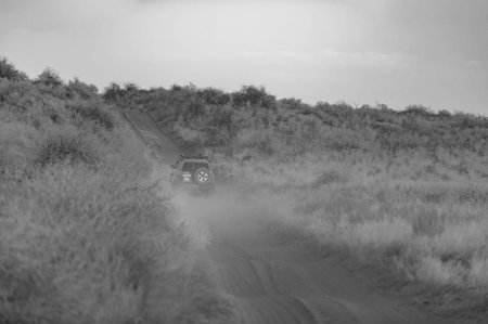 Discover the beauty of black and white photography. Take amazing shots of Dune Road with the car as...