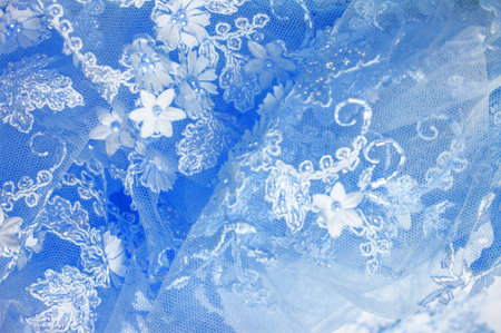 Abstract background design with light blue lace texture. Includes pale blue rods. Old lace. And sapphire lines. Suitable for use as a template or background image.の写真素材