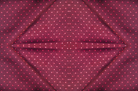Seamless texture. Fabric with a metallic sheen in small polka dots. Red burgundy. Inspires you to go...