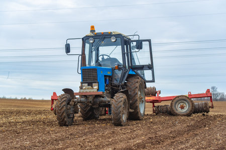 small blue tractor plowing the ground Let's bring life back to earth! Watch as this little blue...