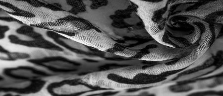 silk fabric black and white with leopard print. Lightweight silk with leopard print will perfectly match your design, looks stylish and not vulgar! Texture, background, patternの写真素材
