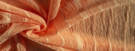 Silk fabric. Texture of brown wrinkled fabric. Brown wrinkled, wavy surface texture. Close-up, background, patternの写真素材