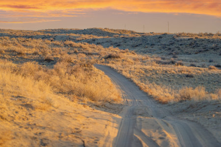 Autumn. Steppe. Sunset. Dunes. Feel the beauty of autumn in the steppe. Watch the sun set over the...