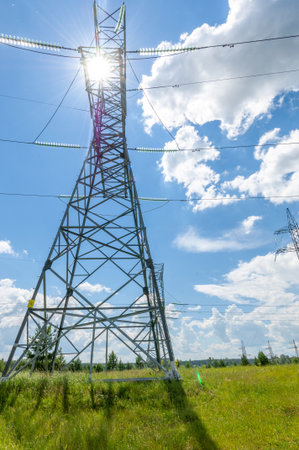 Silhouette of high voltage poles, power tower, electricity pylon, steel trellised tower, in the afternoon in the European part. Texture high voltage pillar, overhead power lineの写真素材