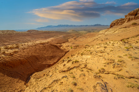 Enjoy a breathtaking sunset over the Red Boguty Mountains. Journey into the stunning desert landscape of Desert Dreams. Witness nature's fiery masterpiece unfolds before your eyes.の写真素材
