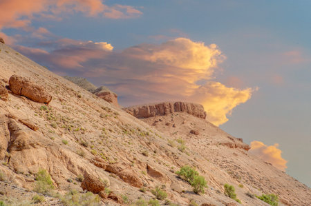 Immerse yourself in the serenity of the Red Mountains of Boguty. Witness the mesmerizing sunset and its enchanting glow. Experience endless possibilities and boundless beauty,の写真素材