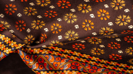 silk fabric of brown color with red and yellow colors, dense fabric, double-sided based on...