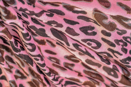 pink silk fabric, leopard print, animal skin, African theme. texture, background, pattern,の写真素材