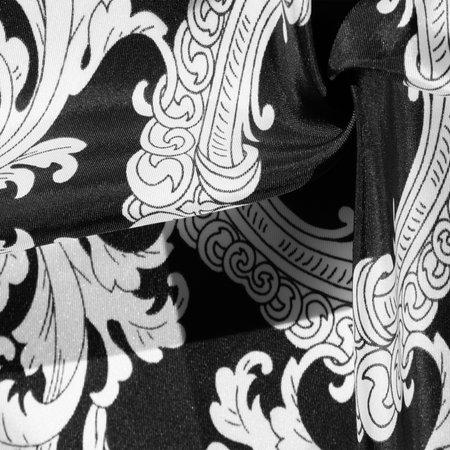 Black and white silk fabric with monogram. Exquisite filigree fabric pattern. texture, background
