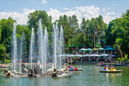 Spend time outdoors in a beautiful park. Opportunities for picnics, sports and recreation. Fun events such as concerts, festivals and outdoor movies. Availability of food vendors and eateries.の写真素材