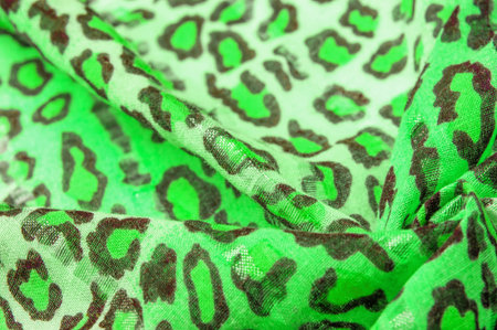 silk fabric green yellow with leopard print. Lightweight leopard print silk is perfect for your design, looks stylish and not vulgar! Texture, background, patternの写真素材