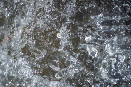 focus blurred, Experience the mesmerizing dance of air bubbles on the water. Immerse yourself in the pure liquid joy of a mountain river. Enjoy the calm beauty of the water. Whisper of nature Nirvana.の写真素材