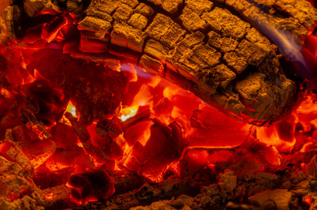 Fire in the fireplace. When we find someone attractive, our pupils dilate, sending a subconscious sign to the other person. In the warm light of a campfire, our pupils naturally dilate.の写真素材