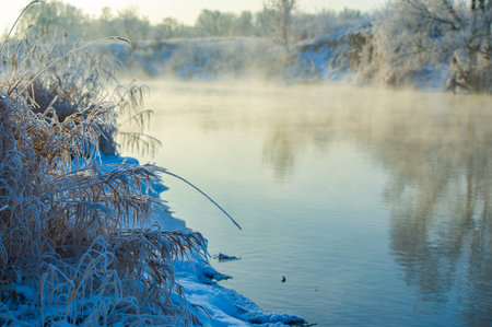Witness the stunning beauty of a frozen river illuminated by the sun. Enjoy the winter spectacle of...