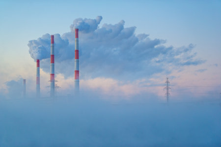 CHP. Enjoy the stunning beauty of winter fog and clouds of smoke. Wake up to a majestic morning filled with spectacular views. A spectacle of nature awaits you. Prepare to be surprised.の写真素材