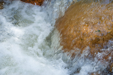 Serenade of nature: feel the soothing melody of water flowing through a mountain stream. Find peace...