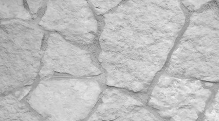 Blurred background. The texture of the stone embedded in the wall, whiteの写真素材