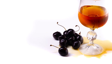 Enjoy a delicious cognac and cherry cocktail. Drink a refreshing cherry infused drink. Pair your drink with delicious food or fruit. Serve in a stylish glass for a classy look.の写真素材