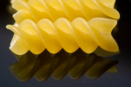 Fusilli is a type of Italian pasta made from durum wheat. Known for its spiral shape. Fusilli goes well with various sauces and ingredients.の写真素材