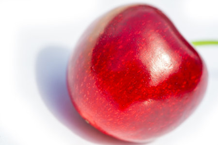 Delicious and nutritious cherries on a white background. Rich in vitamins. Juicy and ripe, ready to pick. Ideal for vegetarians and promotes good health with every bite.の写真素材
