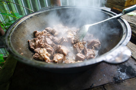 Enjoy the smoky flavor of our kettle roast lamb. Enjoy the taste of meat cooked over an open fire. Experience the unforgettable experience of grilling our smoked meats.の写真素材