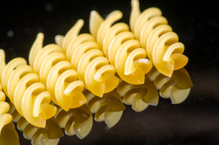 Authentic Italian fusilli pasta made from durum wheat. Available for lunch or dinner. Golden color and delicious taste. Ideal for traditional Italian food.の写真素材