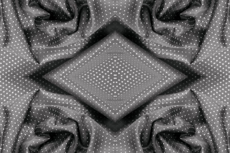 Fabric with a metallic sheen in small polka dots black A polychrome abstract pattern shimmers...