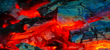 Fire in the fireplace. When we find someone attractive, our pupils dilate, sending a subconscious sign to the other person. In the warm light of a campfire, our pupils naturally dilate.の写真素材