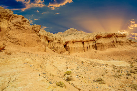 Experience the breathtaking beauty of the Red Boguty Mountains. Witness a mesmerizing sunset over the horizon. Immerse yourself in a tranquil environment where sand and sky meet in harmony.の写真素材